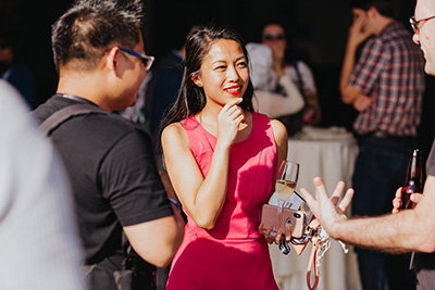 Attendees in conversation at an event